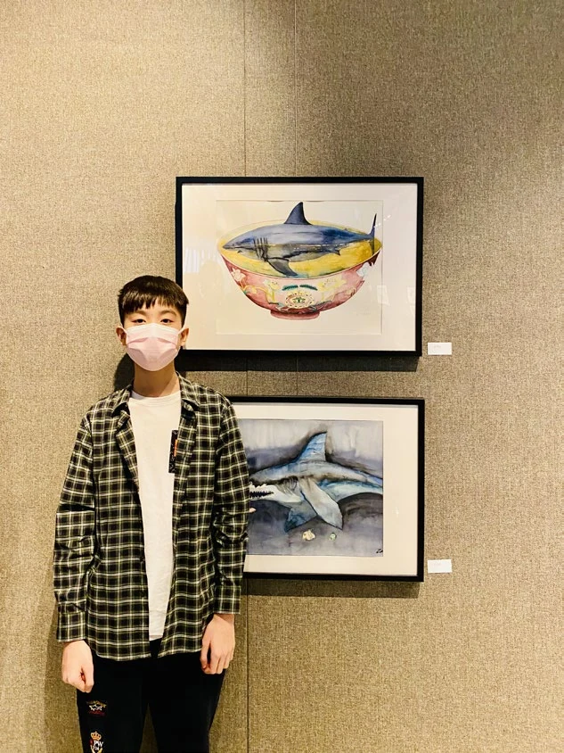Portrait beside The Miserable Shark and another painting